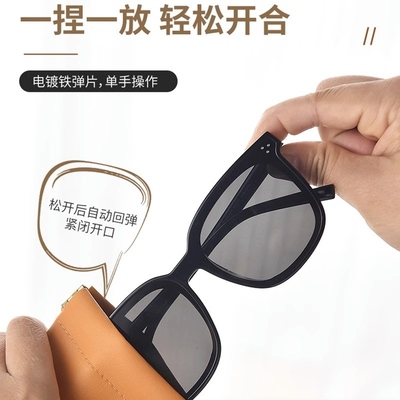 He's got a woman's glasses bag and sunglasses box.