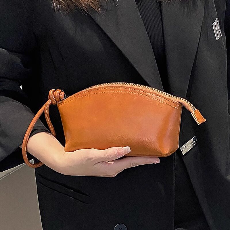 金金兔2026冬季新款女士手拿包大容量贝壳零钱包便携手拎包手机包