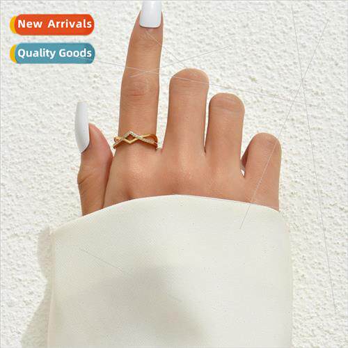 A delicate simple gold cross zirconia ring open micro-set zi