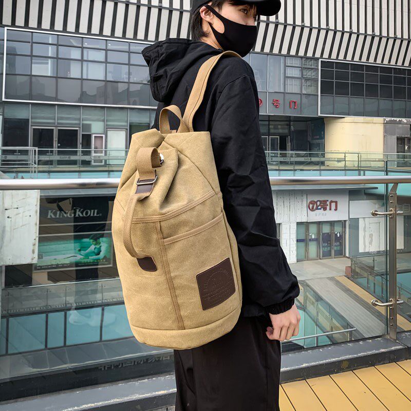 男士双肩包男式背包2024新款包包男款旅行帆布男包休闲户外水桶包图片