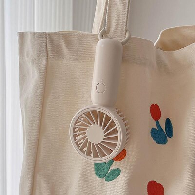 奶油白随身静e音小风扇 便携式手持桌面简约可爱电风扇可挂 续航