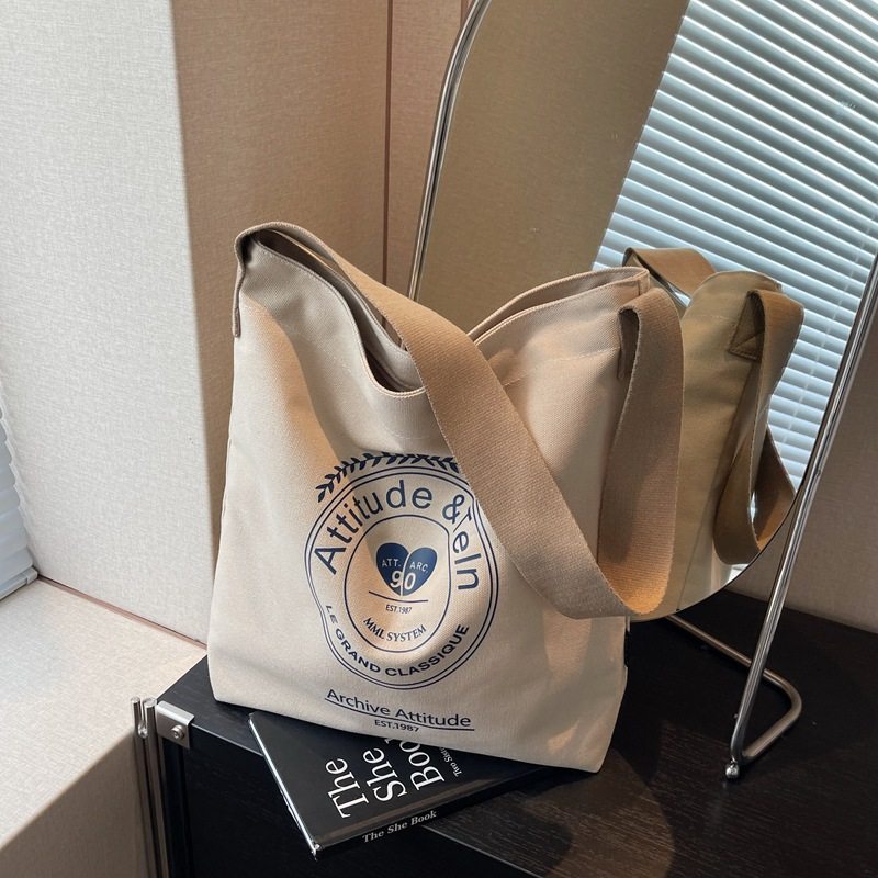 帆布包包女大容量2025春夏文艺范单肩包字母通勤斜挎包慵懒风布袋