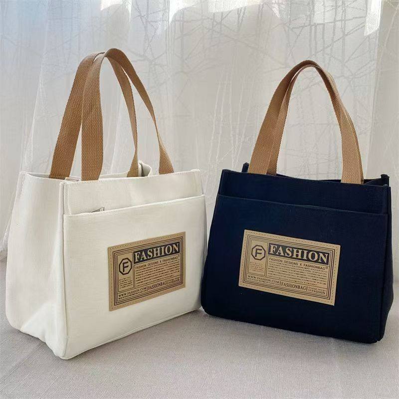 帆布包大容量结实特大号日韩高颜值手提包上班族简约休闲手学生