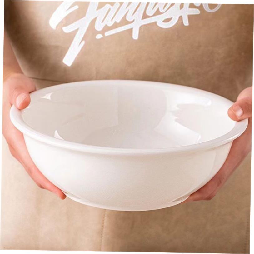 Plain white ceramic salad bowl deep soup plate chopped peppe