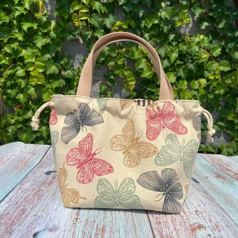 上班族出门通勤小拎包百搭手提杂物袋可爱2022女款轻便帆布便当包