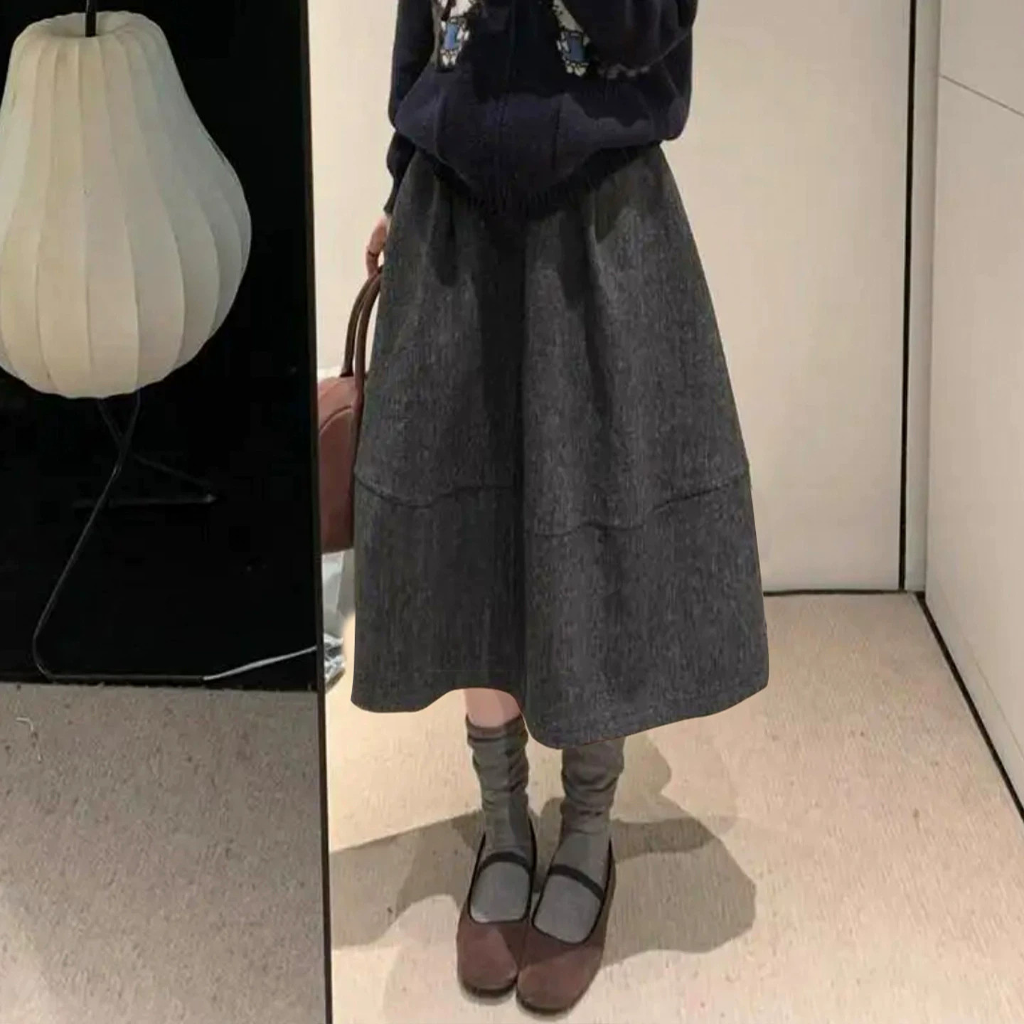 毛呢黑色半身裙短裙女秋冬季2026新款a字伞裙垂坠感五分花苞半裙
