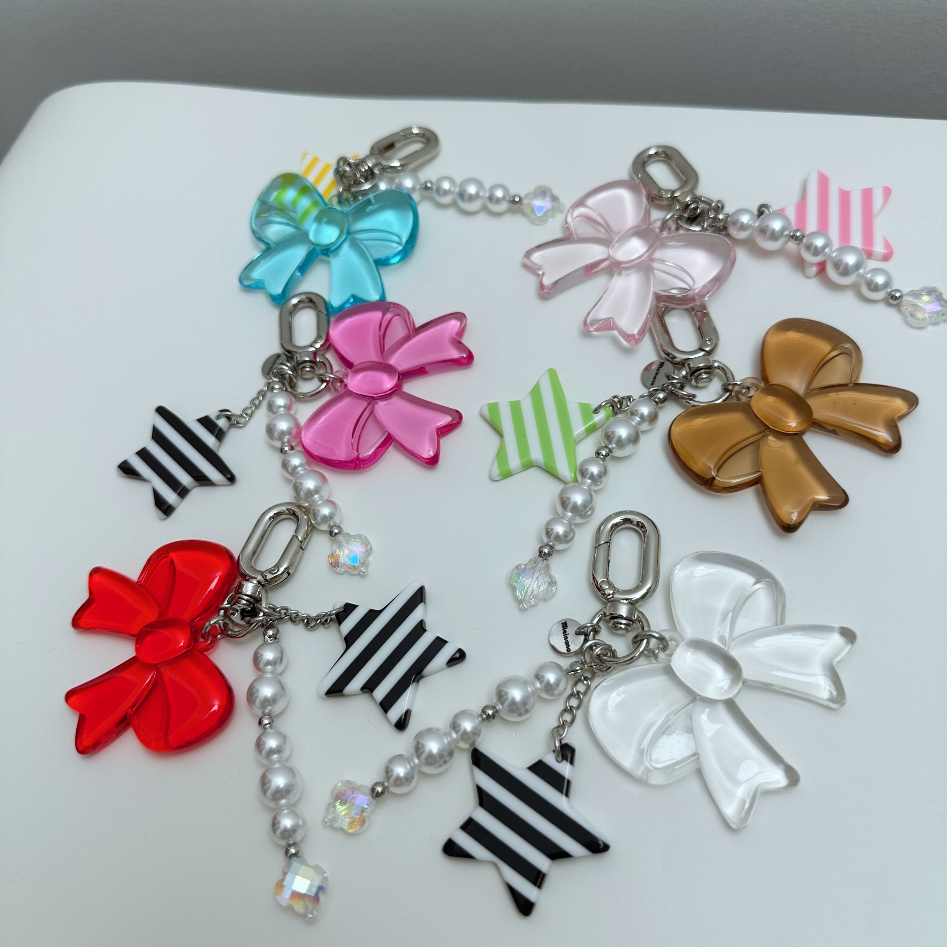 美娜娜水晶蝴蝶结手机挂链苹果包适用iPhone短meinana手机壳挂饰