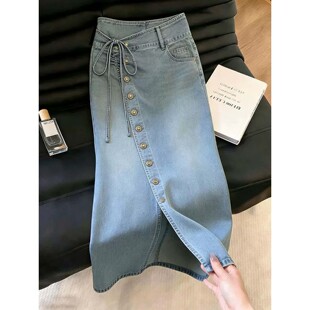 蓝色排扣设计感半身裙女2026夏季新款时髦蝴蝶结绑带开叉牛仔裙子
