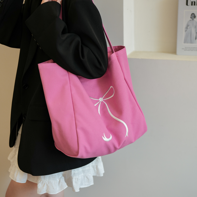 韩版蝴蝶结大容量帆布包包女2024新款时尚夏季学生上课通勤托特包