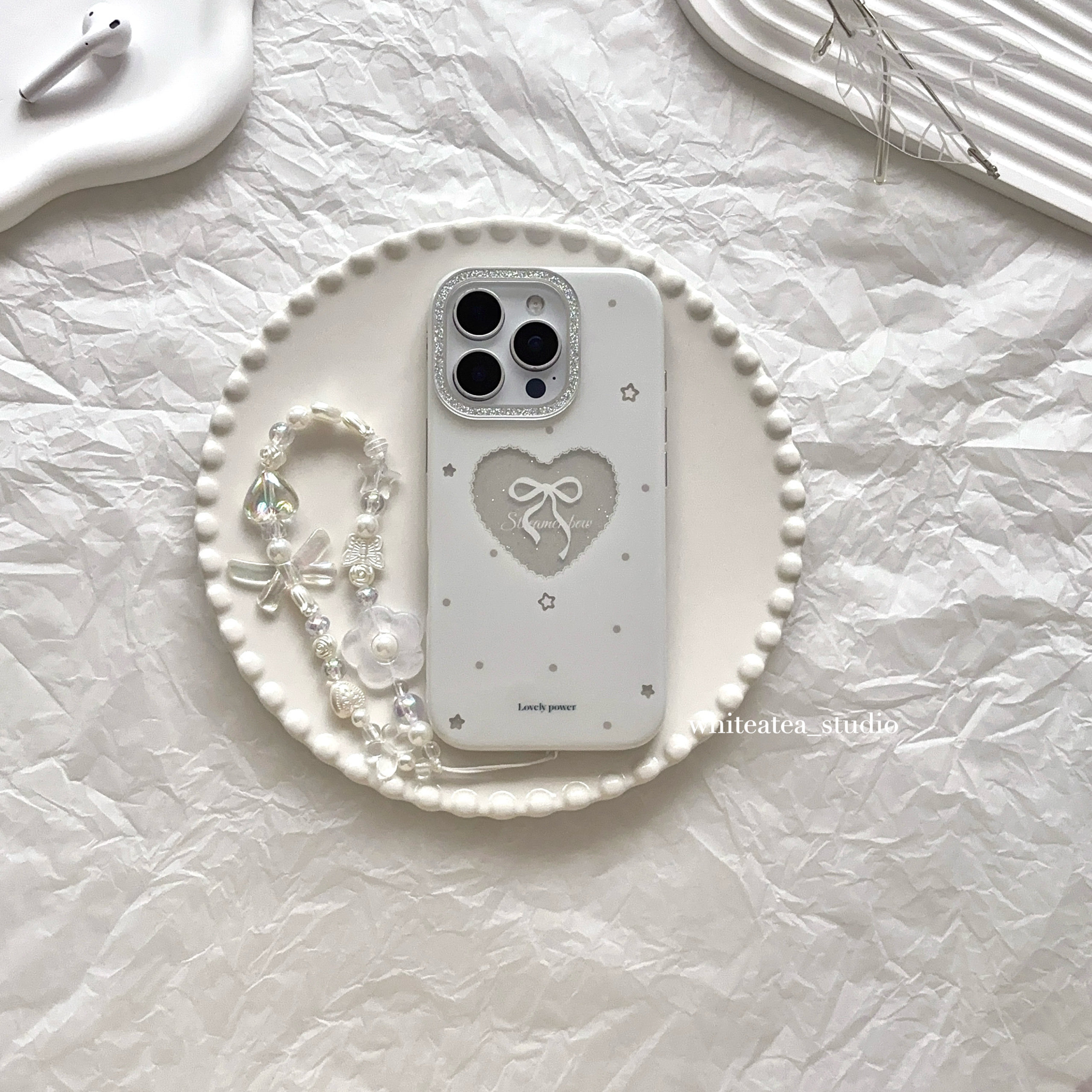 盐白茶ins气质温柔白色镂空闪粉蝴蝶结爱心适用苹果17ProMax手机壳iPhone16小众15新款14高级感13保护套女秋