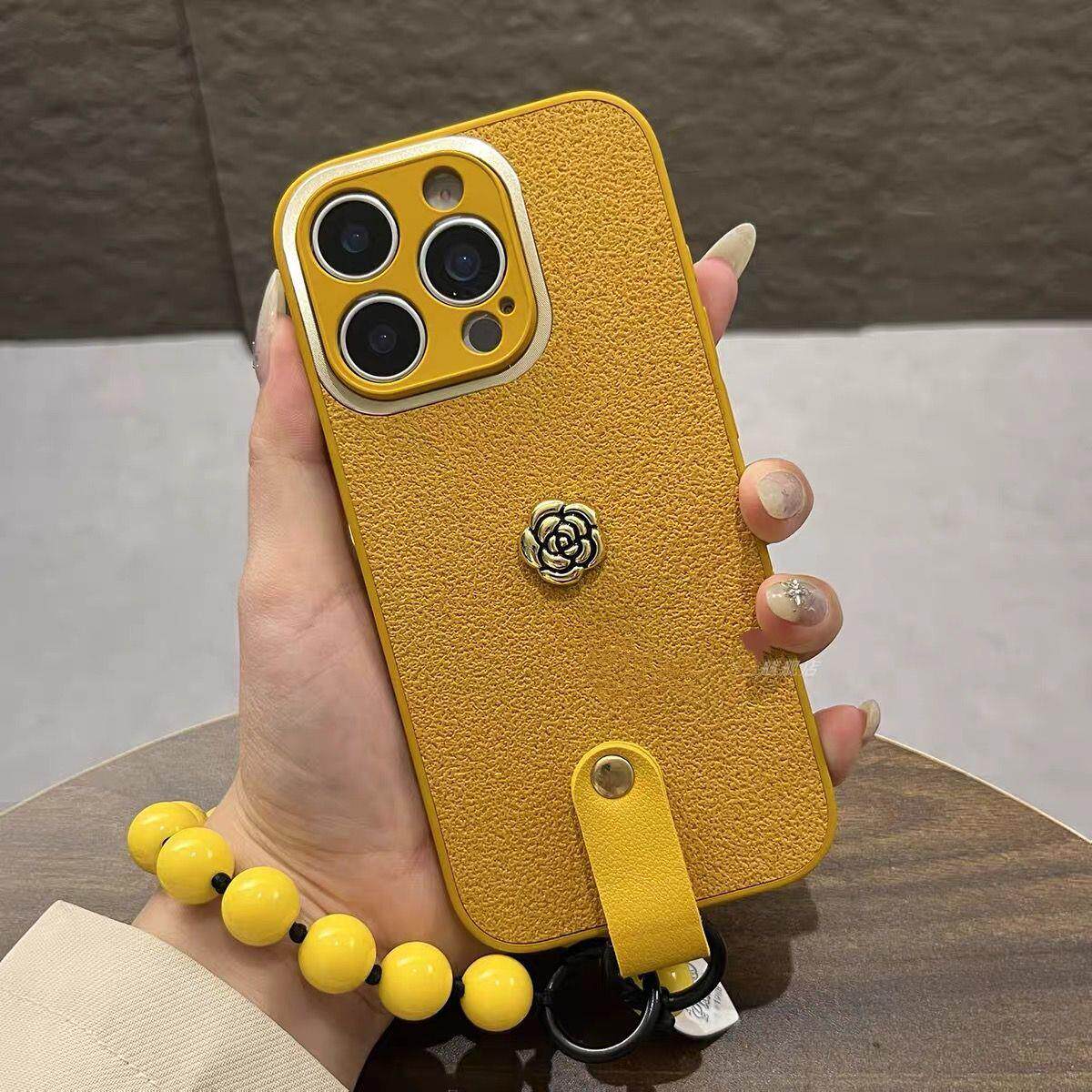 小众黄色山茶花手链适用于iPhone17苹果13/15手机壳16皮质14女12