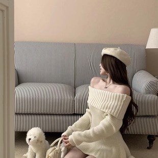 一字肩荷叶边下摆毛衣女秋冬气质修身套头长袖针织衫杏色露肩上衣