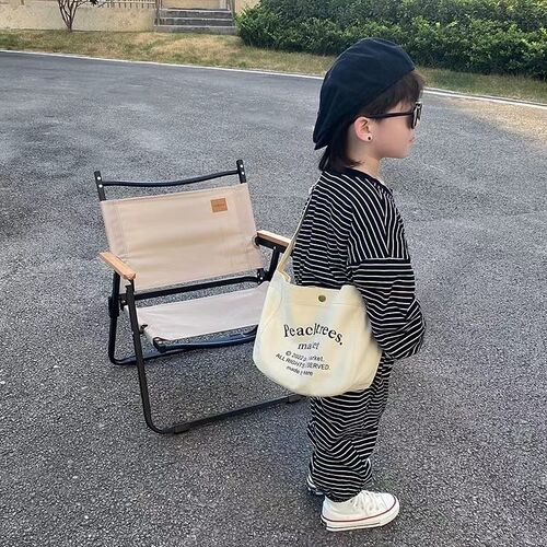网红儿童斜挎包男孩帅气字母帆布包韩版宝宝单肩包女童外出逛街包