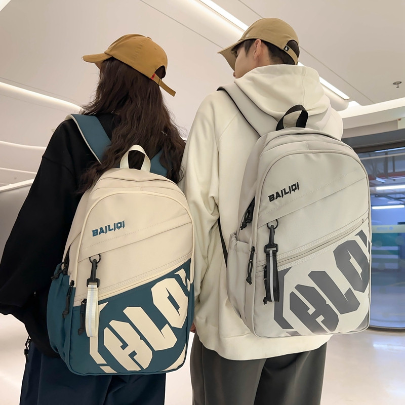 减负护脊书包男生初中生高中生大容量轻便防水中学生女生双肩背包