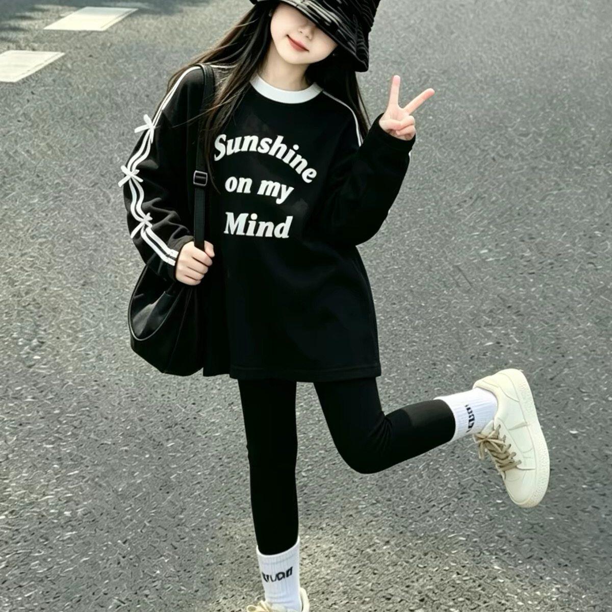 韩国Uamtor女童长袖t恤秋季2026新款黑色印花中大童洋气百搭上衣