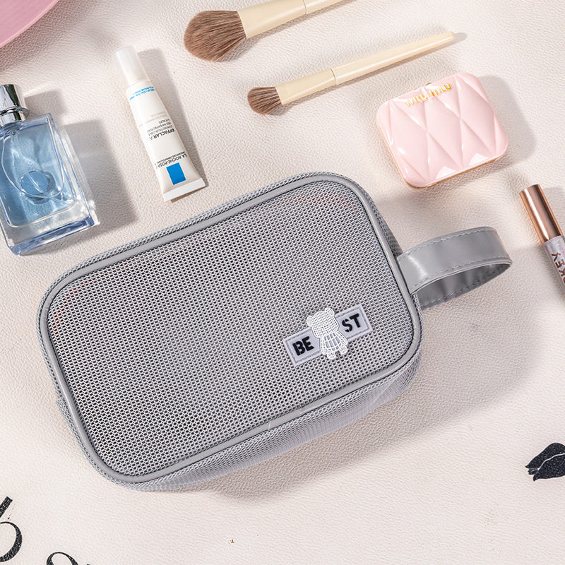 化妆包大容量手提网眼透气刷简约口红水乳套装便携出差旅行洗漱包