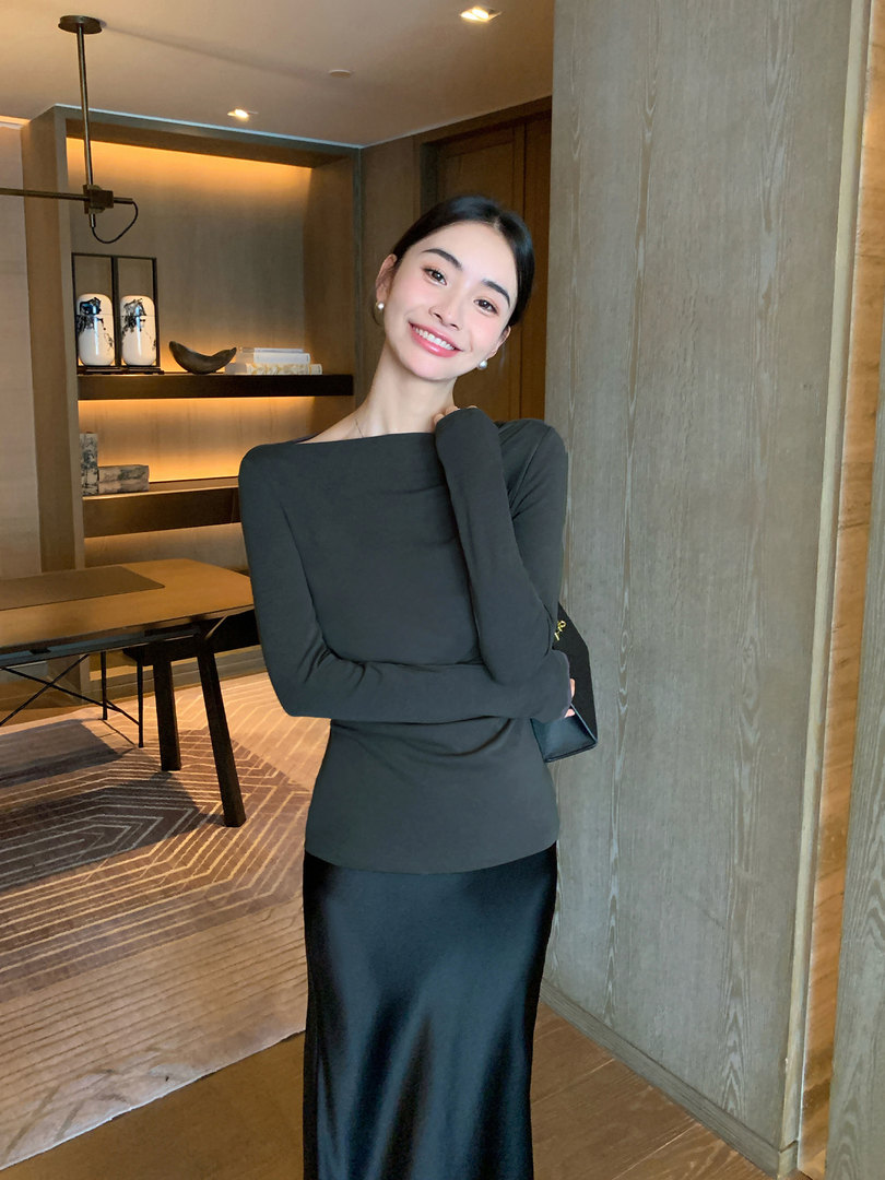 Woman wearing a long black fitted dress