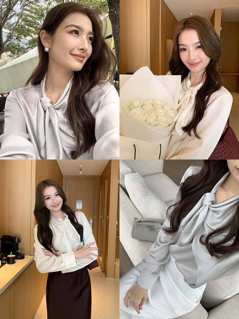 Woman wearing a silky bow-tie blouse in a light neutral color