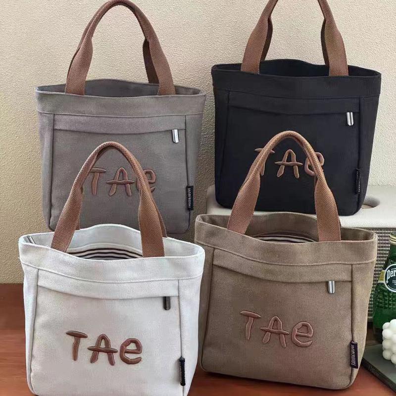 刺绣字母帆布包手提包通勤便当包