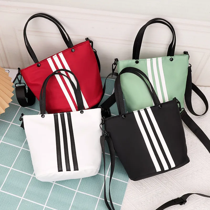 竖条手提包单肩斜挎包女包牛津布手拎包水桶包韩版女士潮休闲百搭