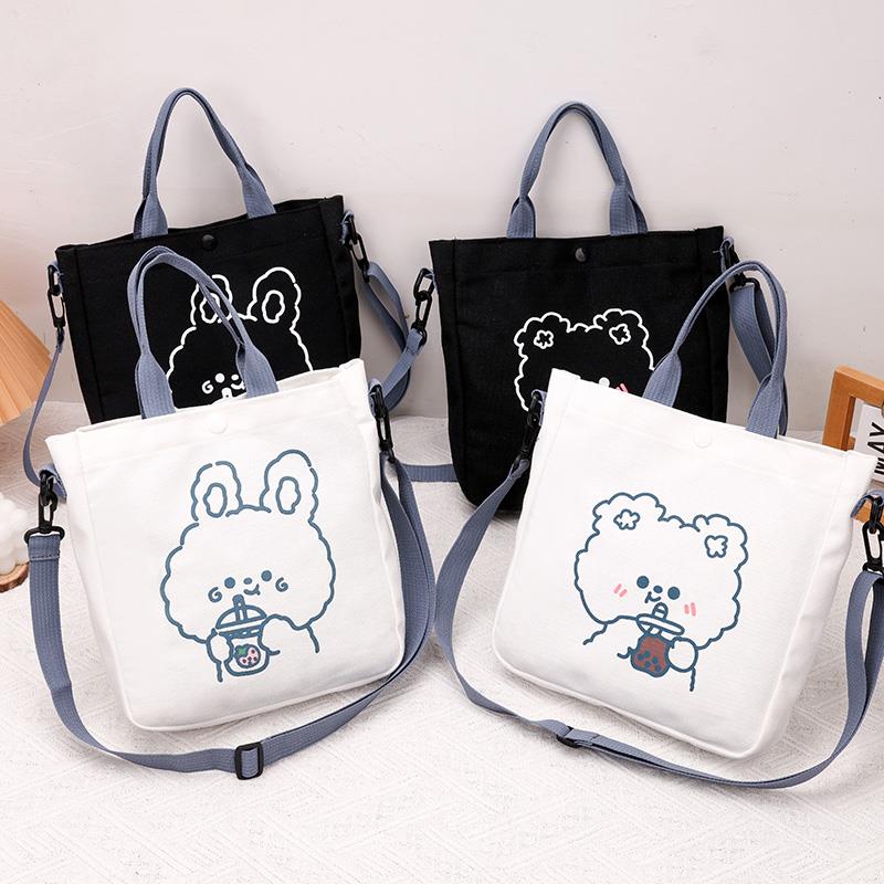 帆布包2023年新款女生包时尚斜挎包可爱卡通小包包学生外出手提包