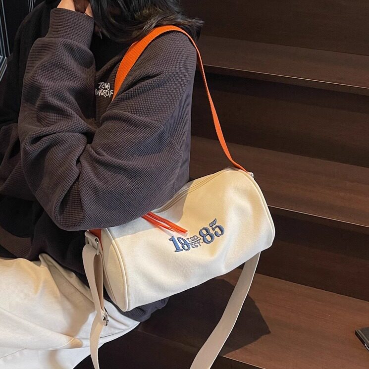 文艺刺绣帆布包包女2025时尚新款圆筒包洋气百搭通勤单肩搭斜挎包