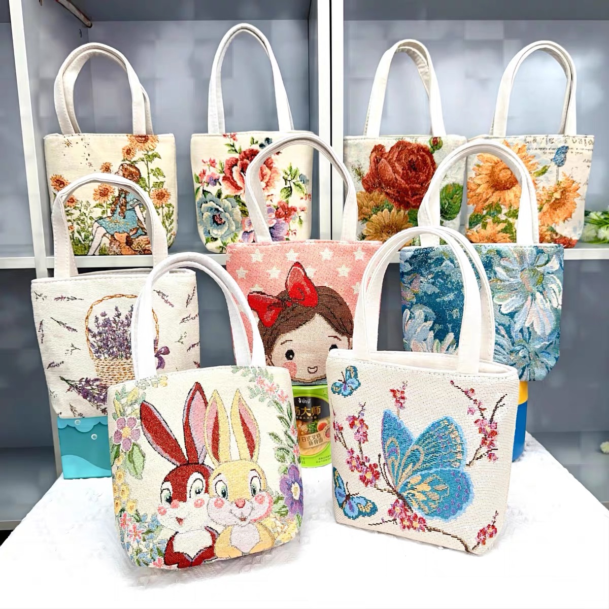 新款可爱双面刺绣帆布手提包拉链外出百搭上班小拎包便携手机包