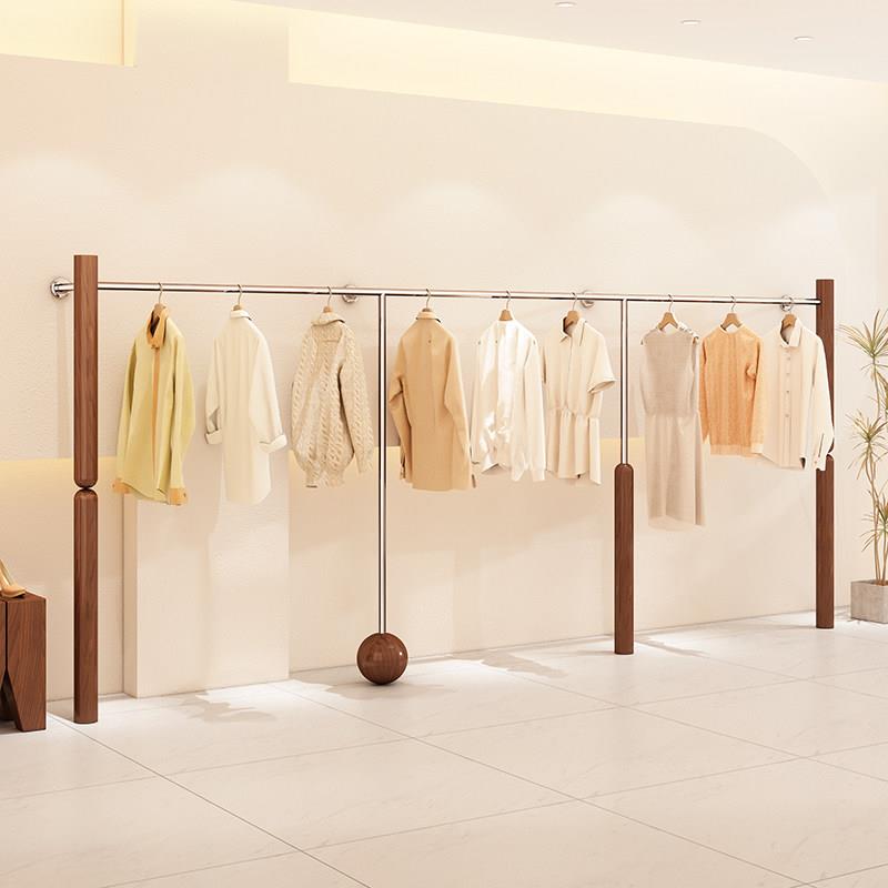 服装店展示架不锈钢木纹色上墙壁挂式陈列架挂衣架女装店货架定制