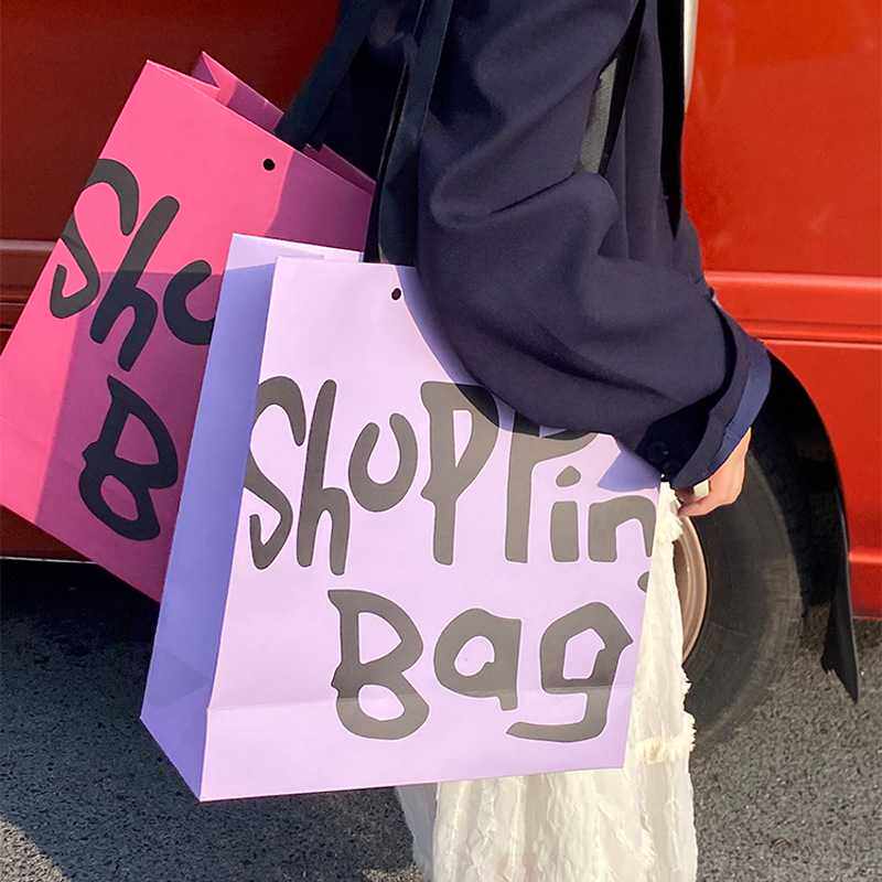 新款直销服装店手提袋加厚白卡纸质购物袋高档礼物品袋子加印logo