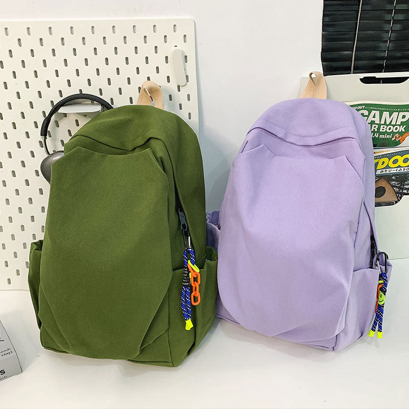 耐磨帆布双肩包女2025新款韩版潮大学生书包男休闲旅行背包大容量