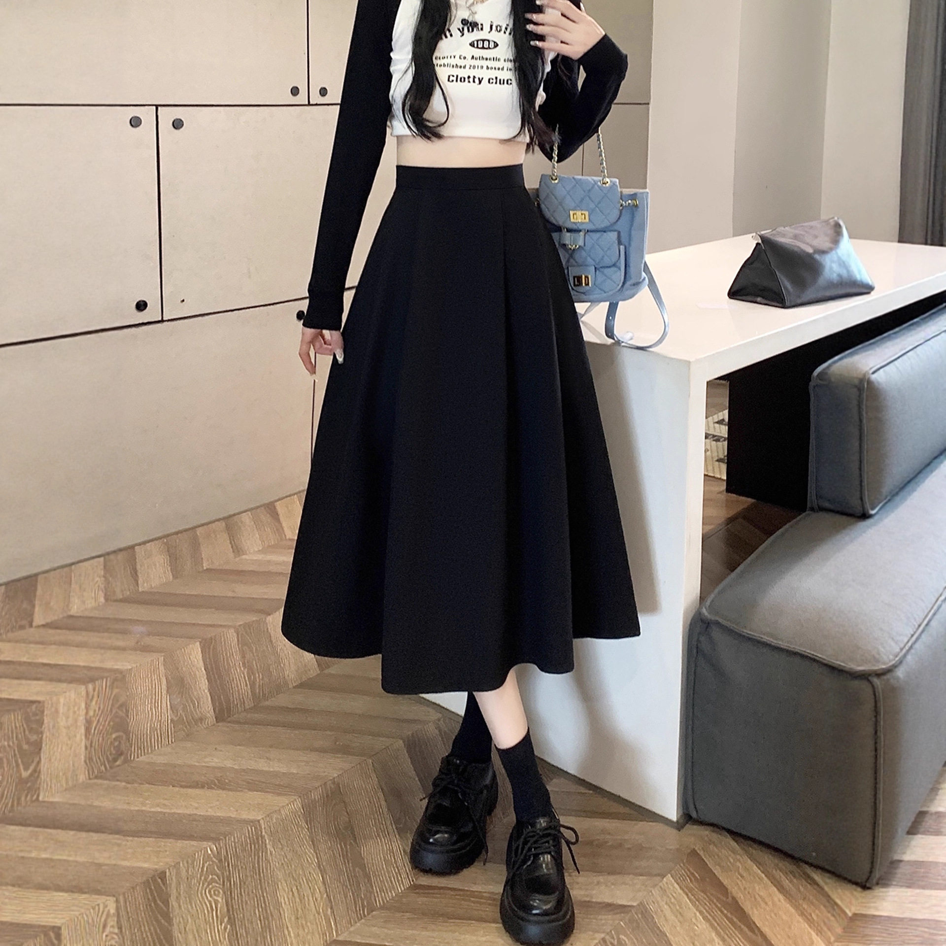 黑色半身裙女秋季中长款百褶a字伞裙2025新款高腰垂感遮胯西装裙