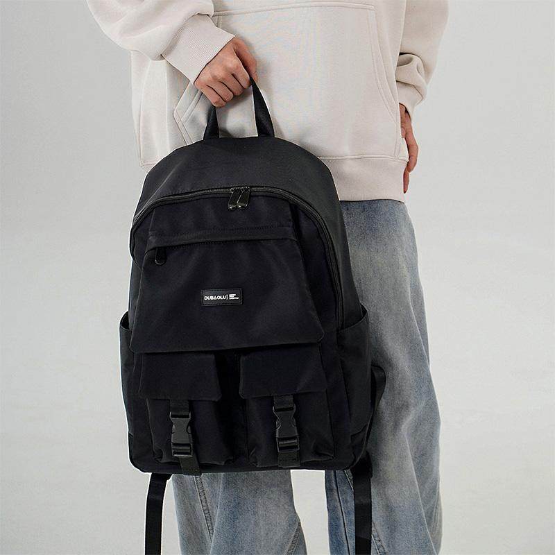 都宝路新款时尚简约多口袋大容量轻便休闲出行商务旅行运动双肩包