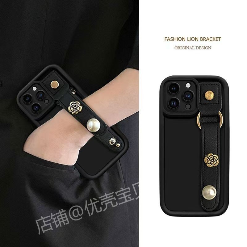 适用苹果16promax手机壳iPhone15手腕带14plus支架12pro山茶花11promax防摔xs时尚7plus欧美xsmax保护套6plus