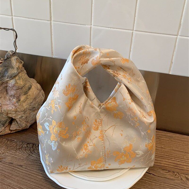 休闲简约手提水桶包包女2026春季新款洋气高级质感轻奢小众手拿包