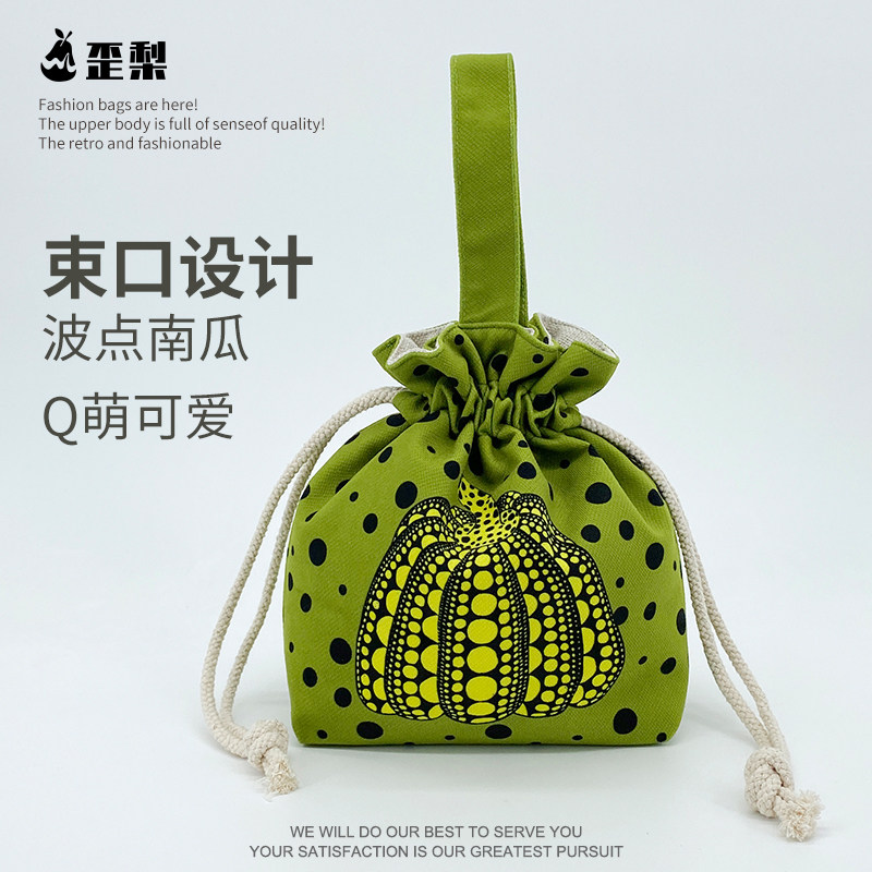 原创绿色波点南瓜手拎束口帆布袋小众便携通勤上班零食收纳包包女
