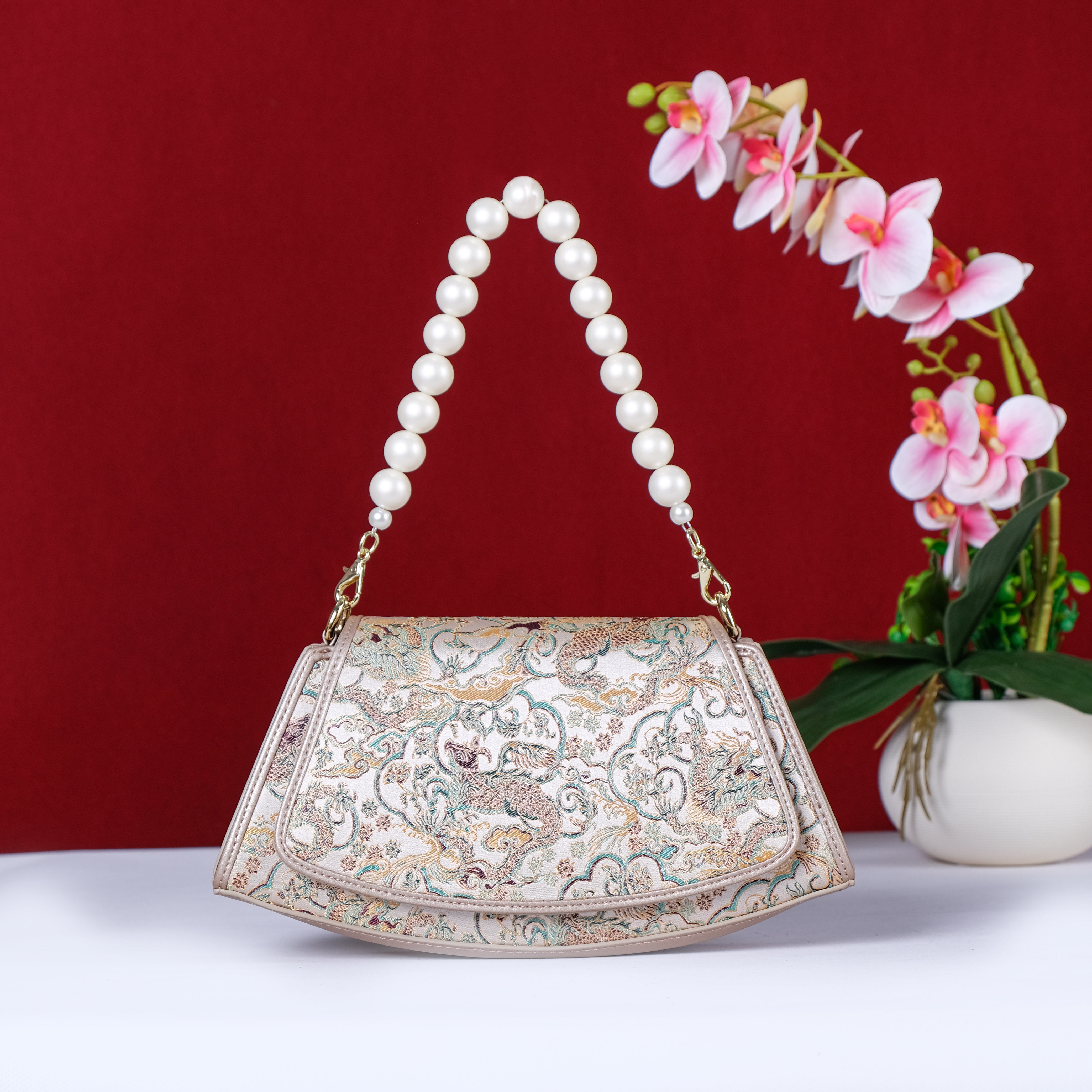 曼莎国风宋锦香云纱手提斜挎刺绣真丝牛皮新款新中式女包旗袍包包