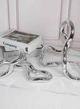 现代轻奢电视柜摆件家居客厅创意银色缠绕环形摆设样板间软装饰品