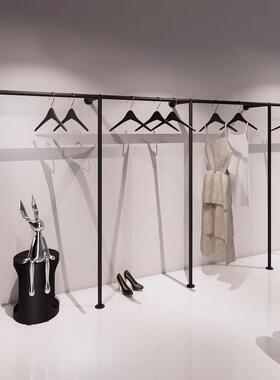 采购产品服装商店展示架黑色壁挂式妇女服装和儿童服装商店展示架