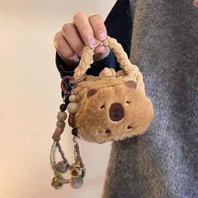 手工针织毛绒耳机包零钱包水豚迷你便携收纳零钱包可爱书包小挂件