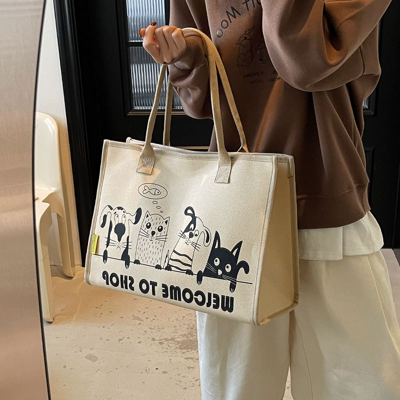 休闲帆布托特包女2025新款大容量通勤包轻便手提购物袋单肩妈咪包