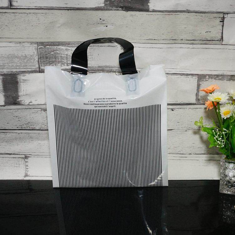 新款直销经典时尚白色条纹塑料胶袋童装男女装商场服装手提袋礼品