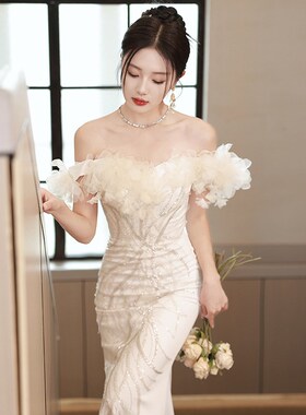 一字肩晚礼服2024新款欧美端轻奢连衣裙亮片鱼尾主持人白色礼服明