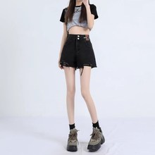 2024年春夏薄款黑色毛边牛仔短裤女高腰a字流苏显瘦辣妹宽松热裤