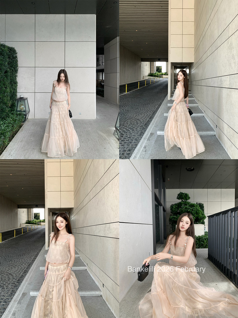 Model wearing a beige flowing maxi dress