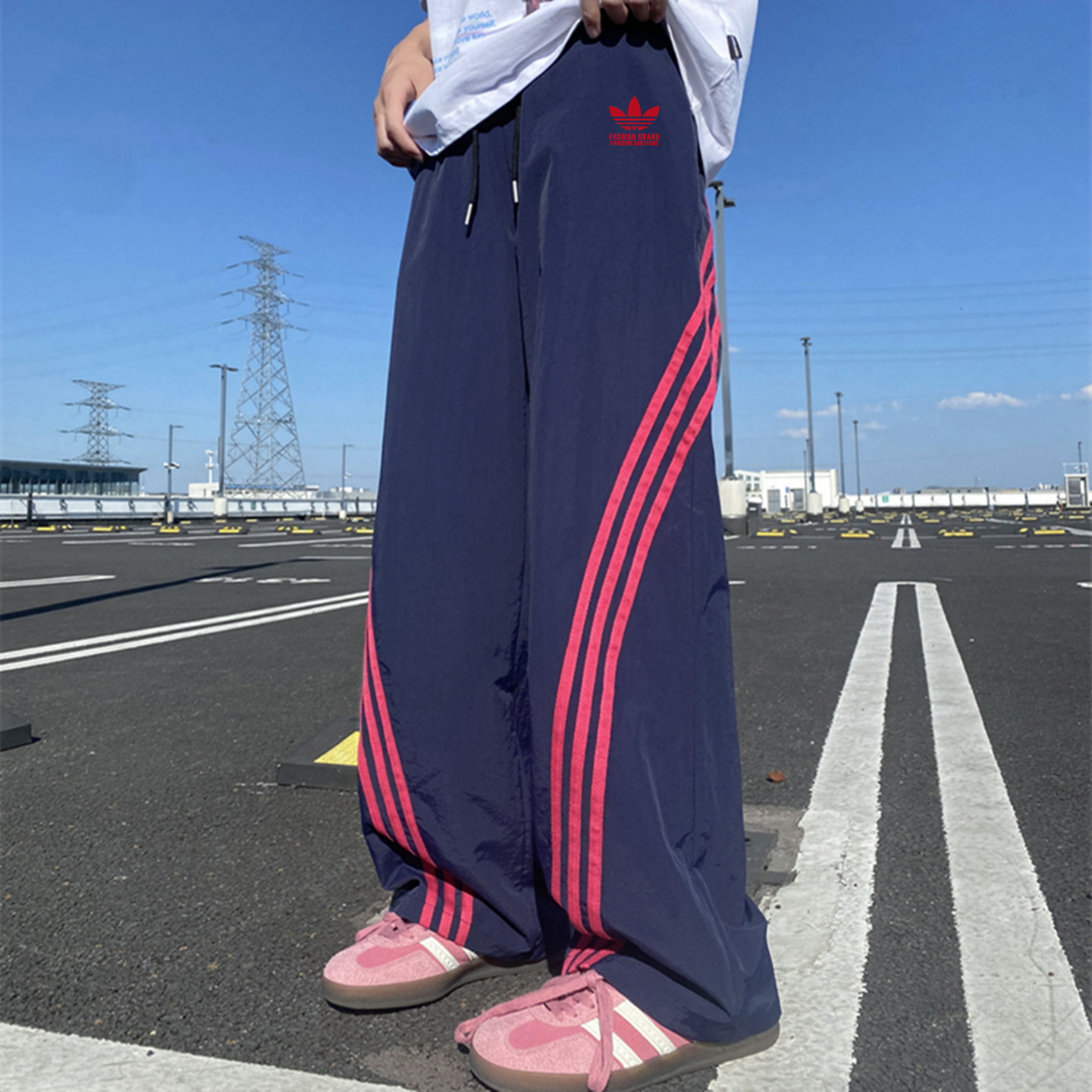 奥特莱斯官网2026夏季薄款冰丝运动裤子卫裤男三条杠宽松休闲裤女