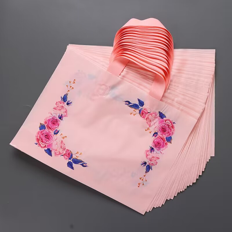 女装店服装袋子定做化妆品店手提袋童装包装袋定制塑料美容礼品袋