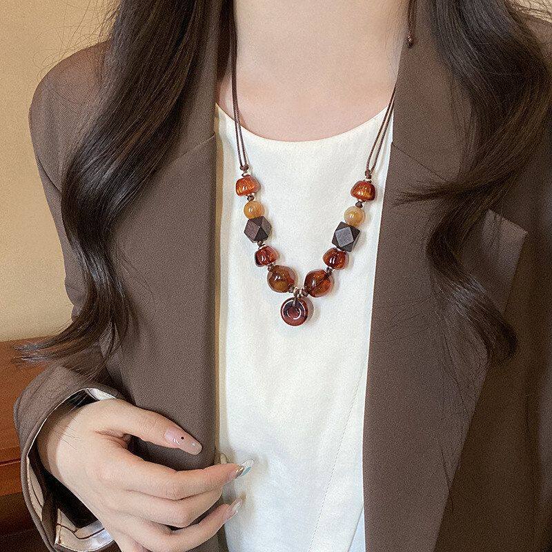 项链异形毛衣链女小众琥珀色木质皮绳长款串珠配饰复古民族风吊坠