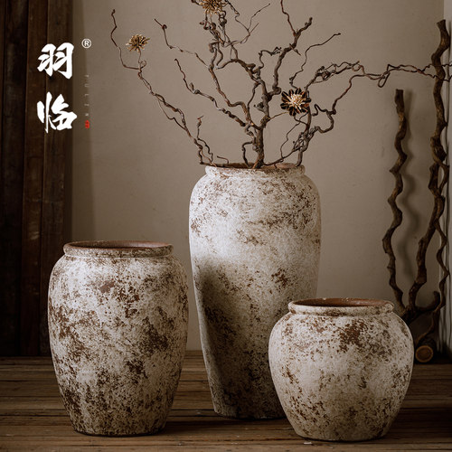 落地老陶罐插枯枝干花侘寂样板间