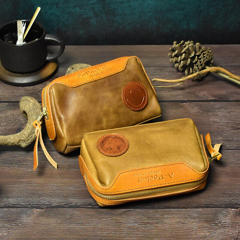 文艺复古男包真皮手机包女士手拿包软皮化装包多功能收纳包笑脸包