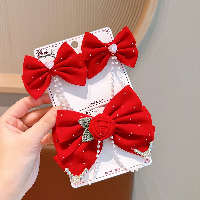 小女孩新年款大红色蝴蝶结发夹公主蕾丝流苏毛球发卡节日儿童发夹